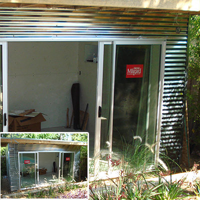 L.A. CONSTRUCTION CRAFT custom built office with metal siding and sliding glass doos