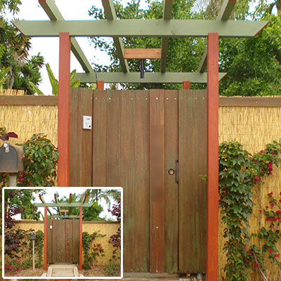 L.A. CONSTRUCTION CRAFT custom built bamboo fence and gate with arbor.